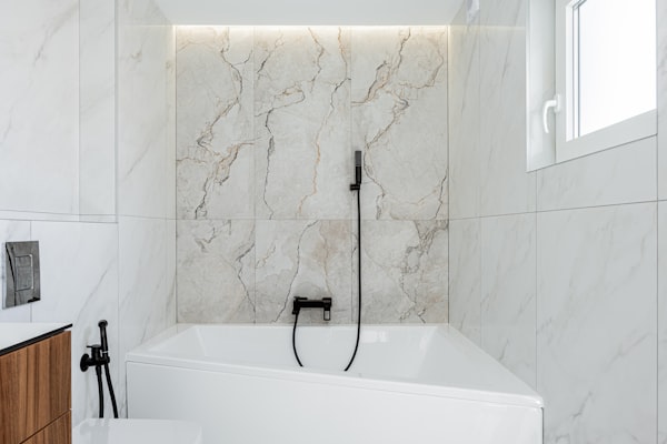 Luxury marble bathtub with modern fixtures